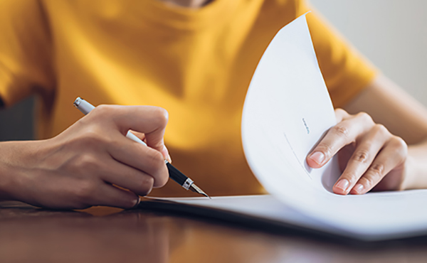patient filling out a form for dr. jian shen endoscopic spine surgeon